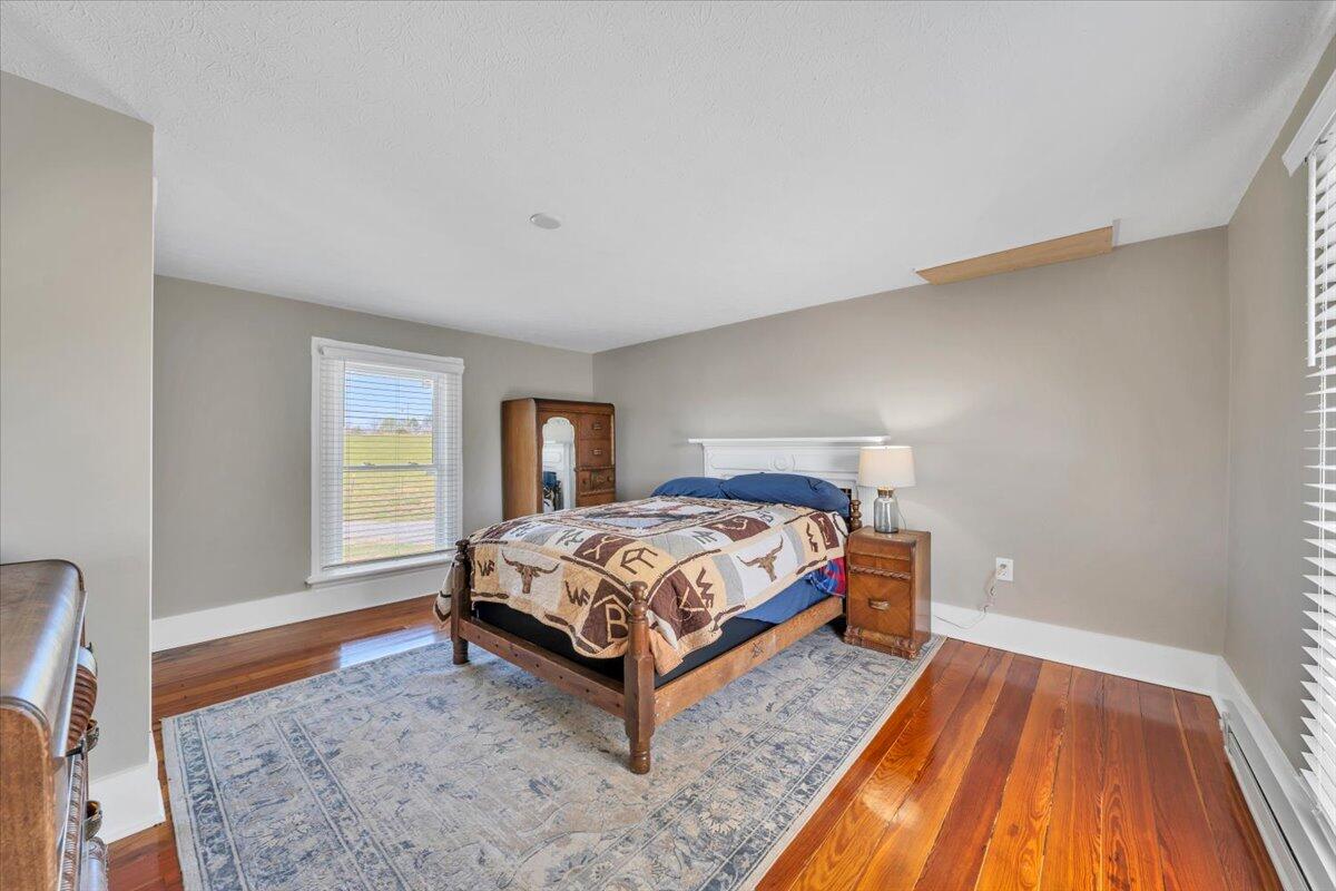 3861 Wheatland Road Bedford, VA 24523 - Photo 42 of 99 a bedroom with a bed and window