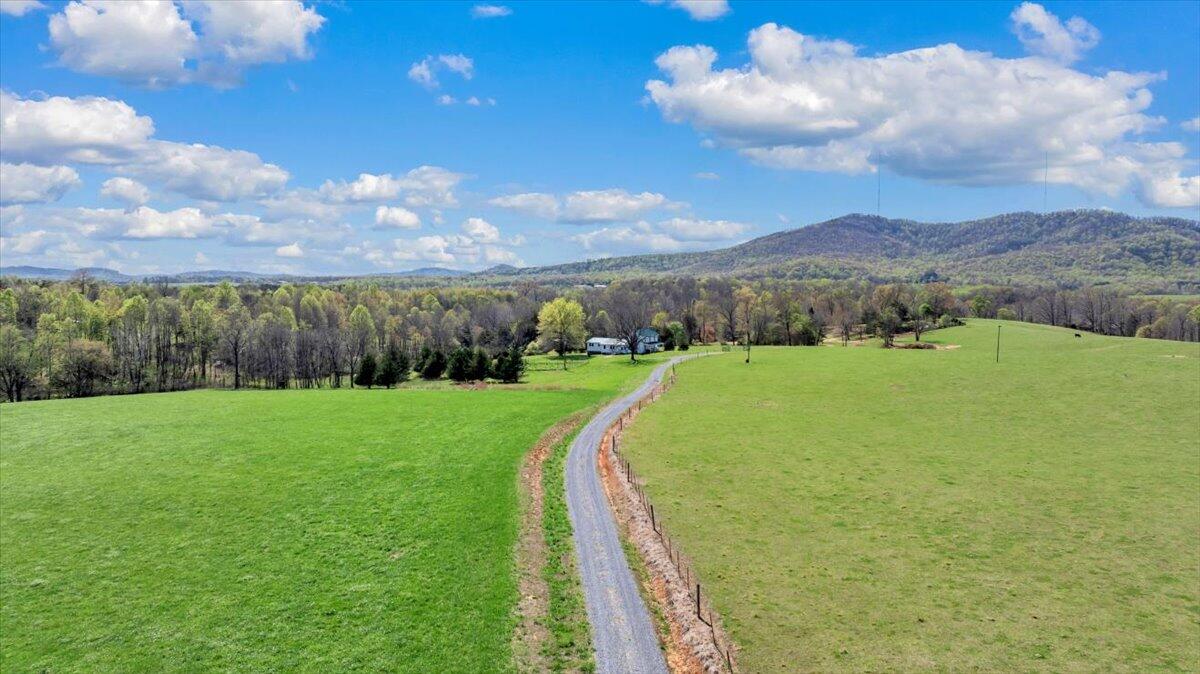 3861 Wheatland Road Bedford, VA 24523 - Photo 83 of 99 a view of a lake with a yard