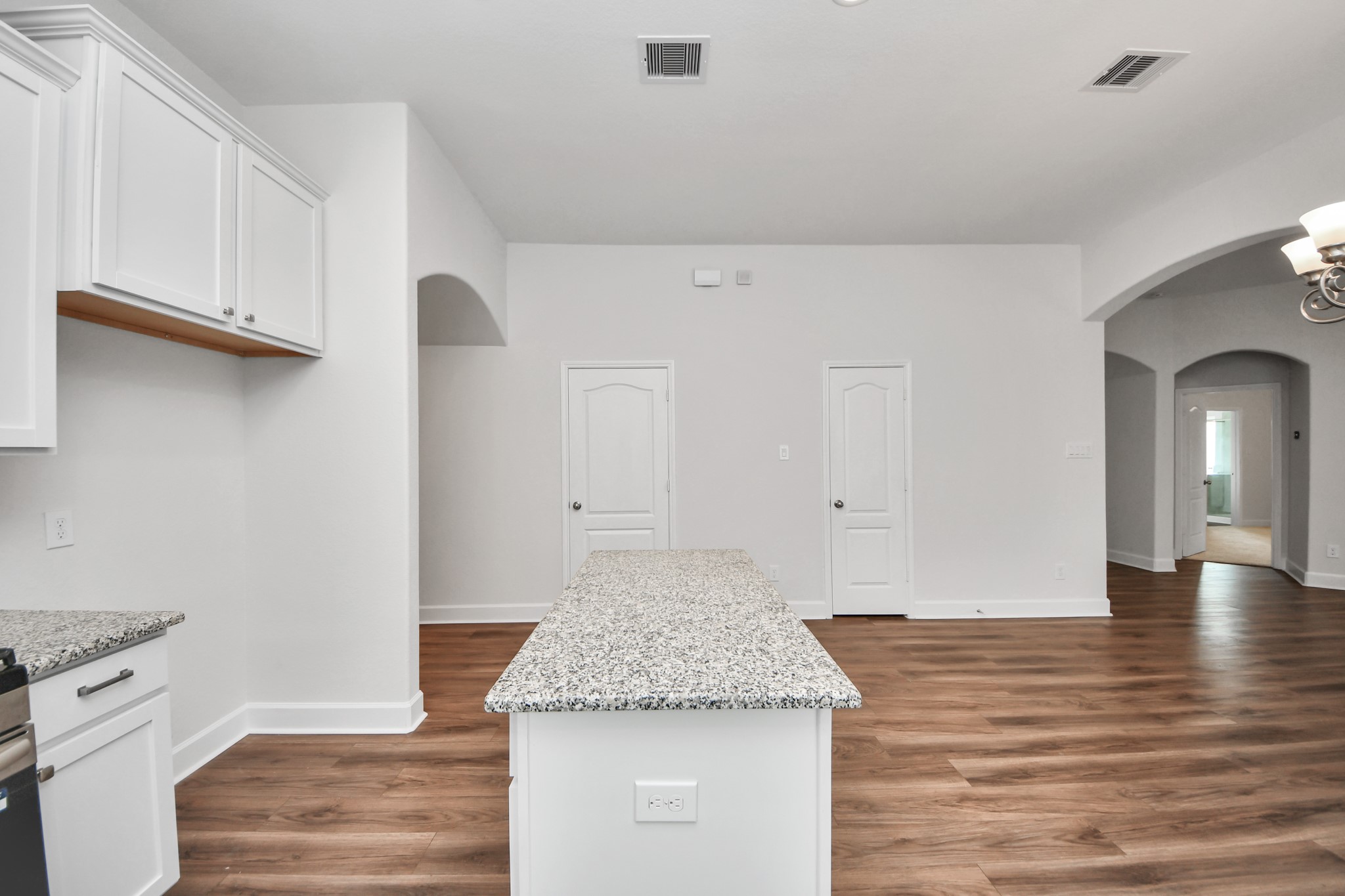1614 Diamond Mountain Drive Rosharon, TX 77583 - Photo 11 of 40 a kitchen with granite countertop white cabinets and a fireplace