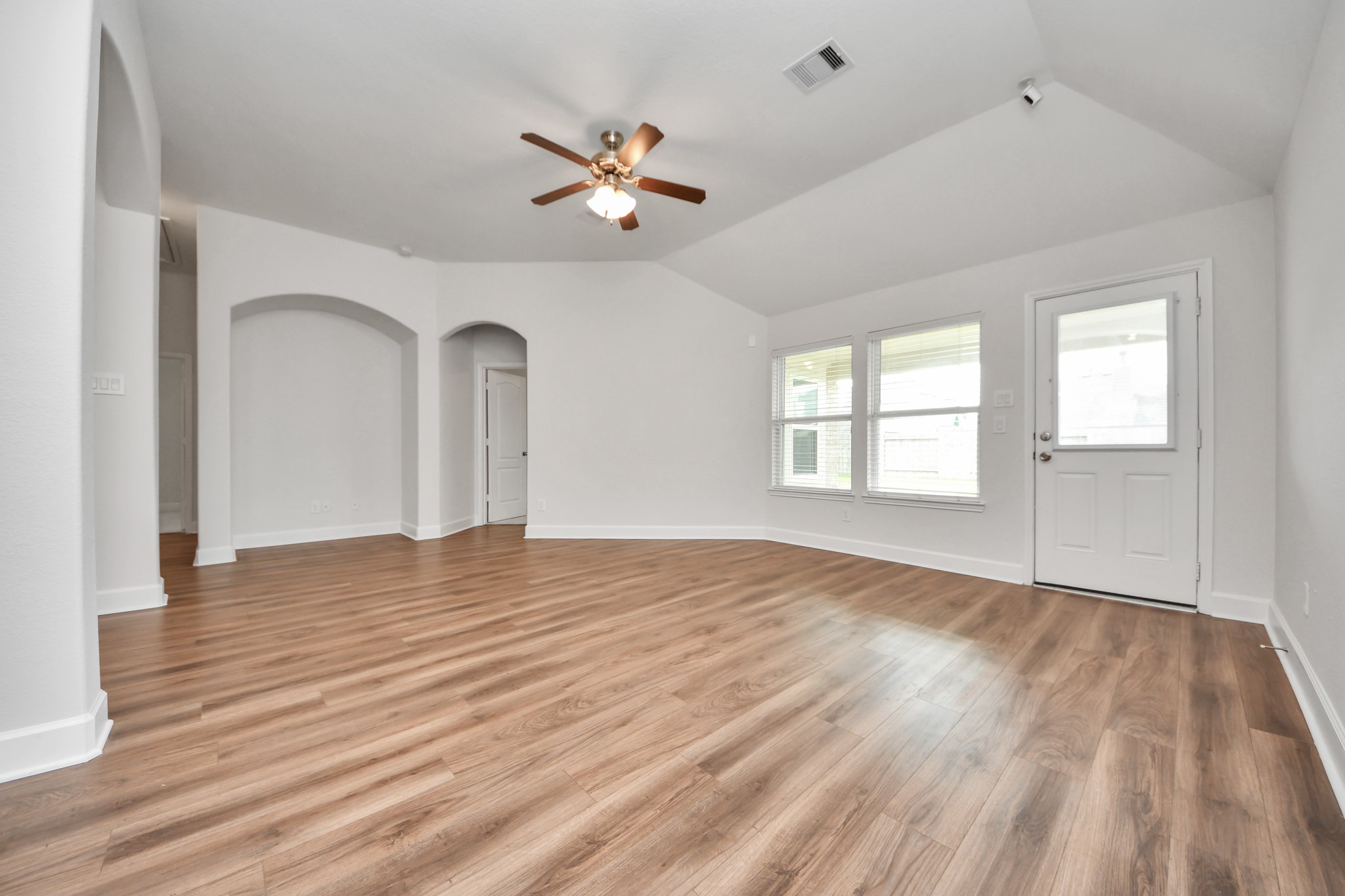 1614 Diamond Mountain Drive Rosharon, TX 77583 - Photo 16 of 40 a view of empty room with wooden floor and fan