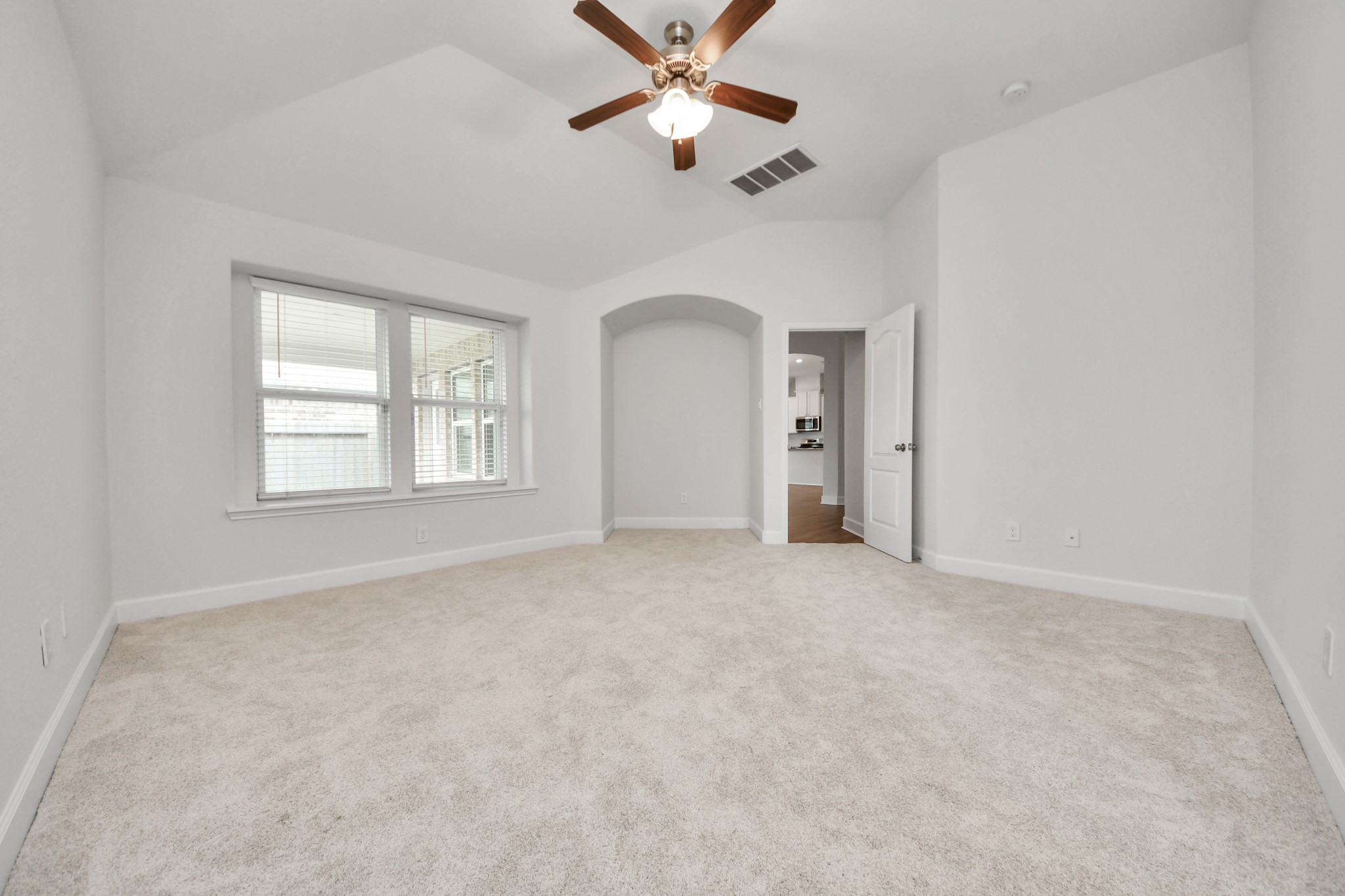 1614 Diamond Mountain Drive Rosharon, TX 77583 - Photo 18 of 40 an empty room with chandelier fan and windows