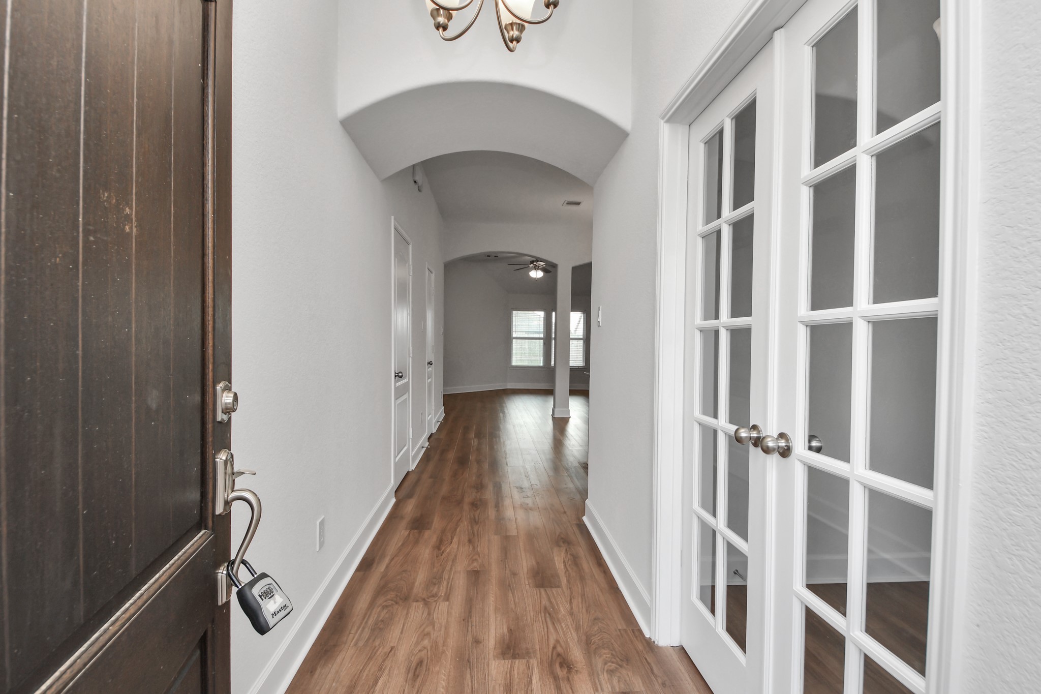 1614 Diamond Mountain Drive Rosharon, TX 77583 - Photo 3 of 40 a view of a hallway with wooden floor and staircase