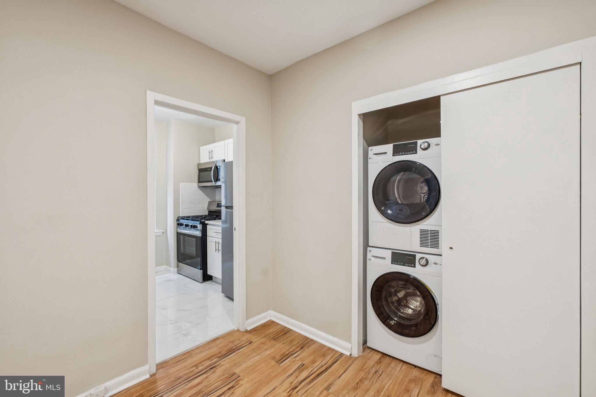 135 South 19th Street, Unit 908 Philadelphia, PA 19103 - Photo 4 of 18 a view of a hallway with washer and dryer