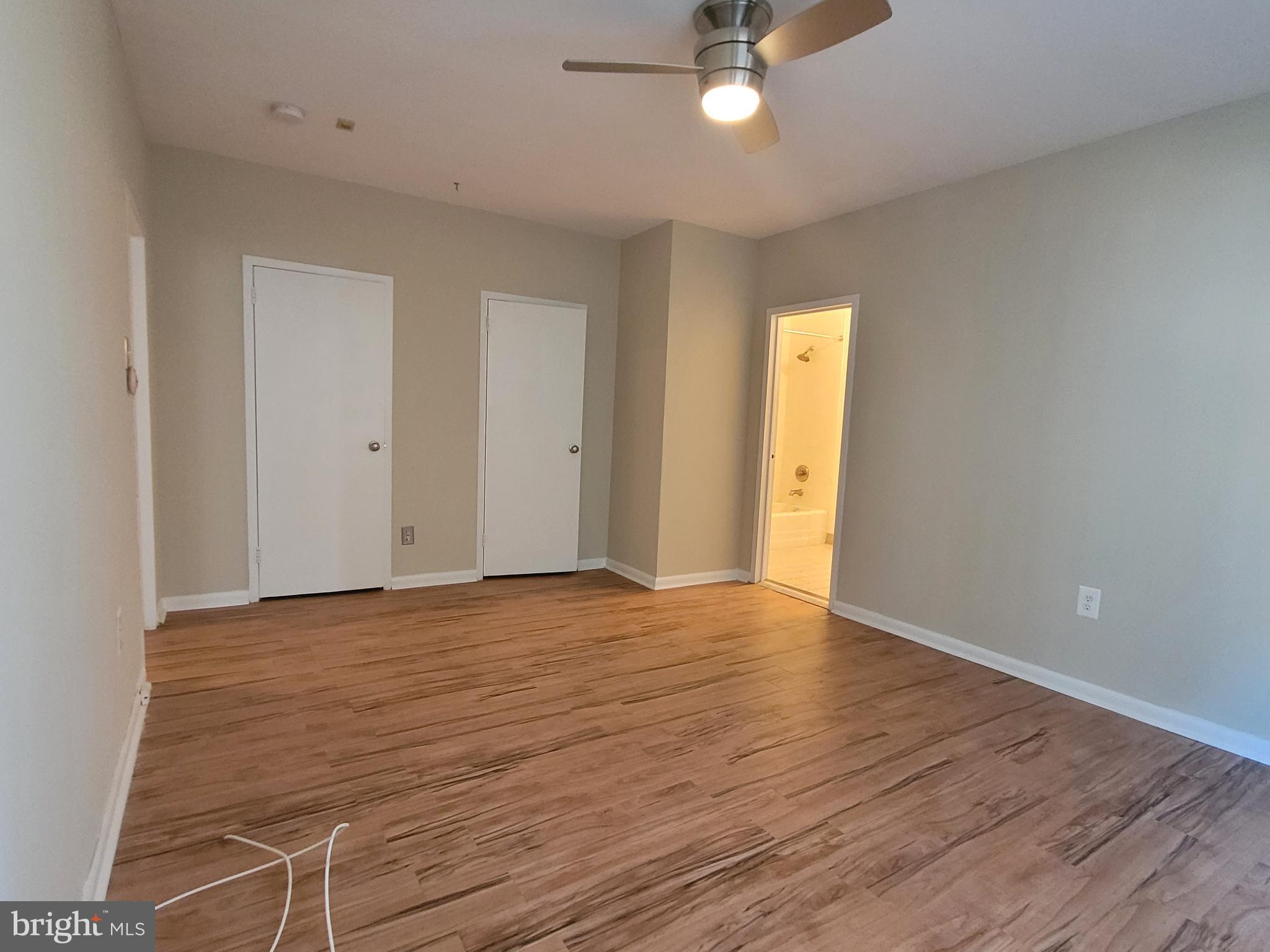 135 South 19th Street, Unit 908 Philadelphia, PA 19103 - Photo 10 of 20 wooden floor in an empty room