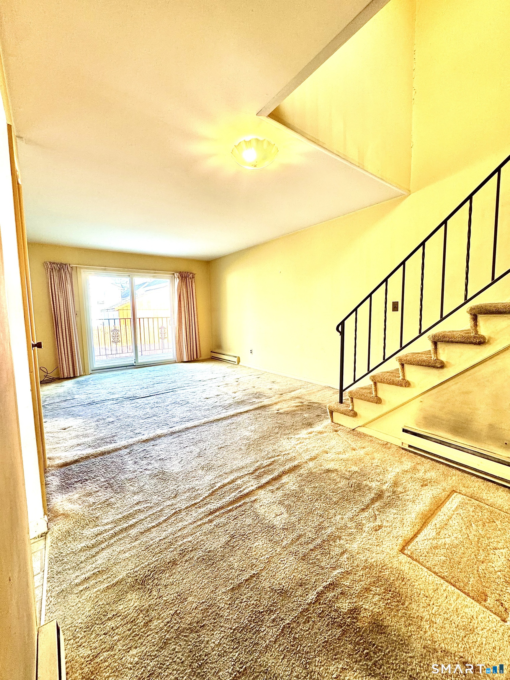 39 Woodway Road, Unit C5 Stamford, CT 06907 - Photo 9 of 55 Entryway view: Stairway upstairs, dining room, sliders to balcony