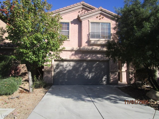 9014 Rutherford Grove Street Las Vegas, NV 89148 - Photo 21 of 22 Mediterranean / spanish house with a garage, stucco siding, concrete driveway, and a tiled roof