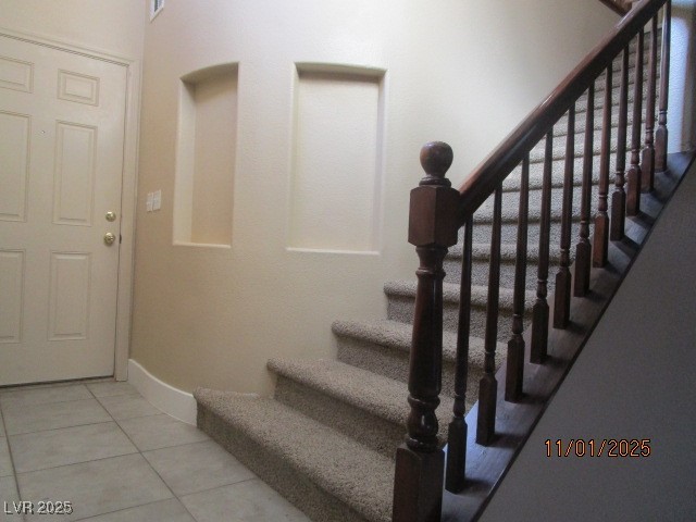 9014 Rutherford Grove Street Las Vegas, NV 89148 - Photo 6 of 22 Stairs with tile patterned floors and baseboards