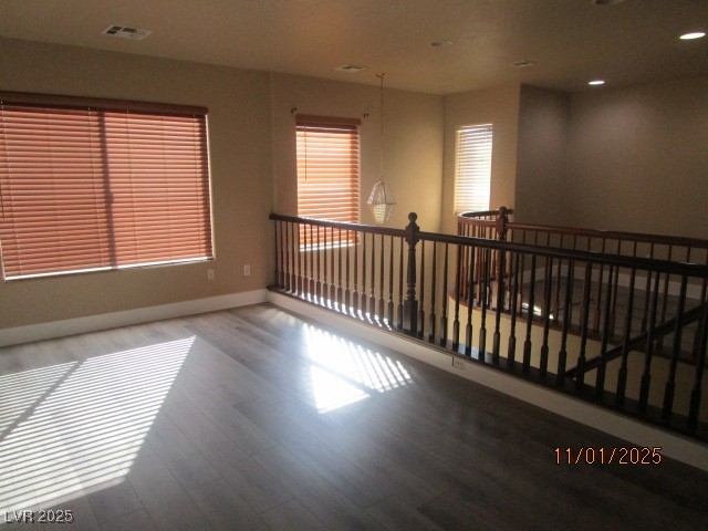 9014 Rutherford Grove Street Las Vegas, NV 89148 - Photo 7 of 22 Unfurnished room with wood finished floors and recessed lighting