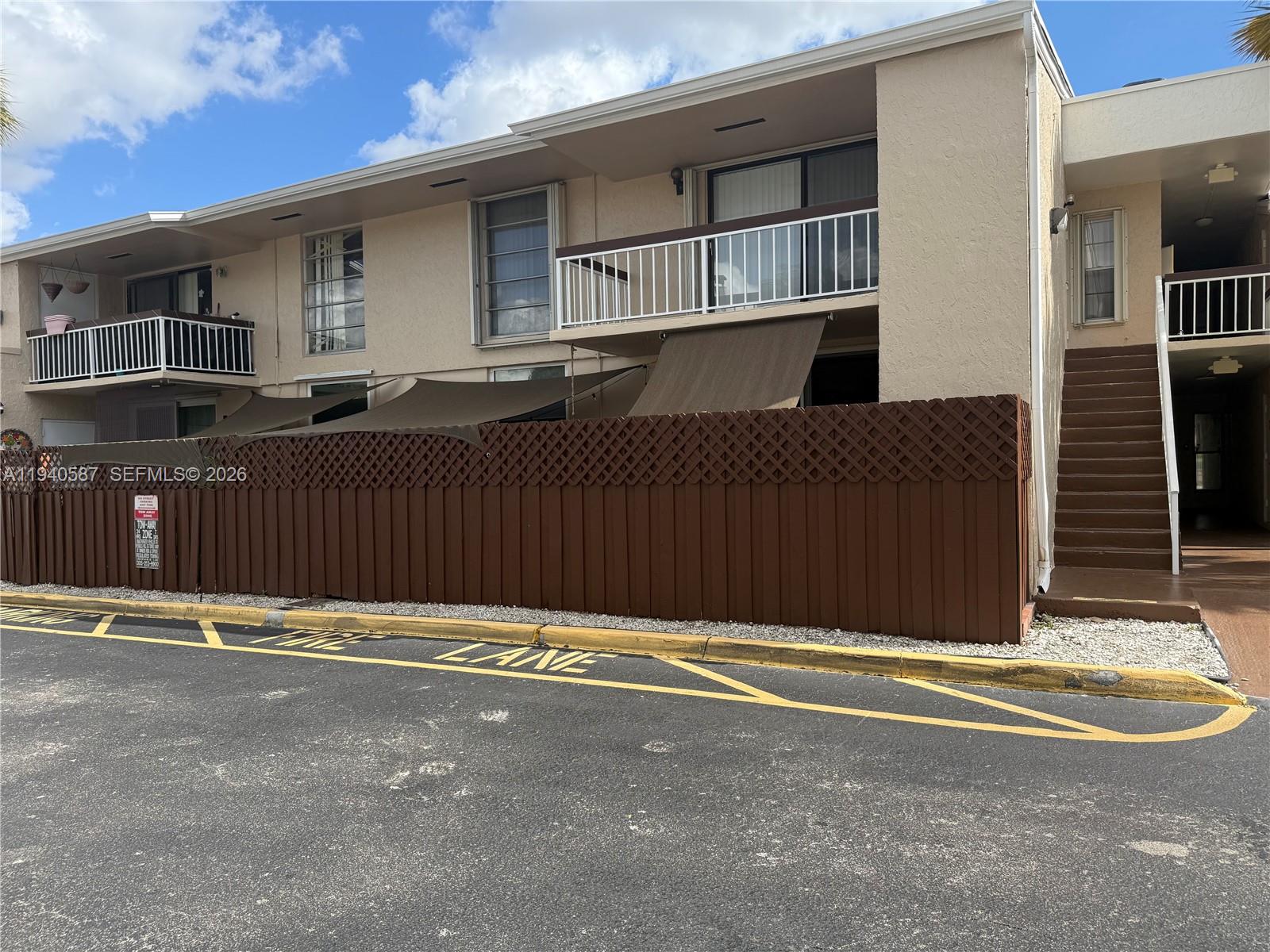 13783 Southwest 66th Street, Unit 203A Miami, FL 33183 - Photo 2 of 13 a front view of a house with a street
