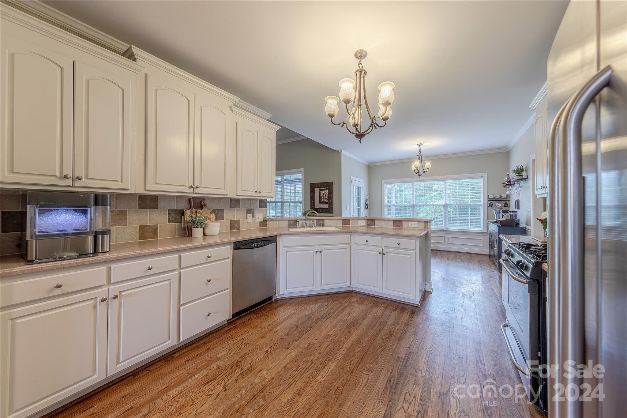 3321 Millstone Creek Road Lancaster, SC 29720 - Photo 15 of 48 a large kitchen with a large window a counter space a sink stainless steel appliances and cabinets