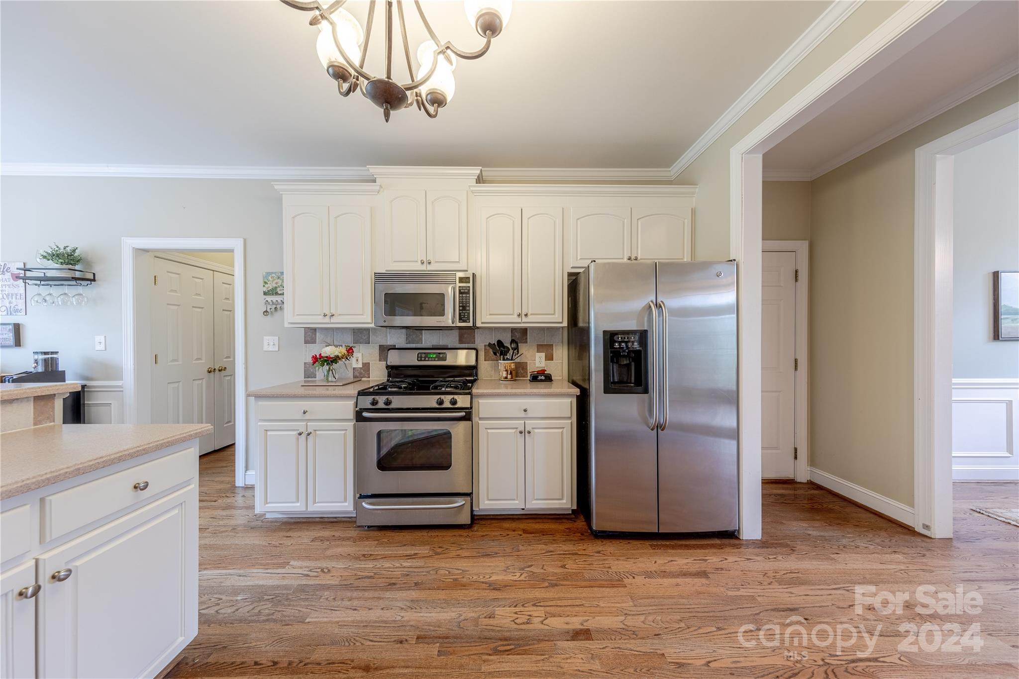 3321 Millstone Creek Road Lancaster, SC 29720 - Photo 19 of 48 a kitchen with white cabinets stainless steel appliances and a window