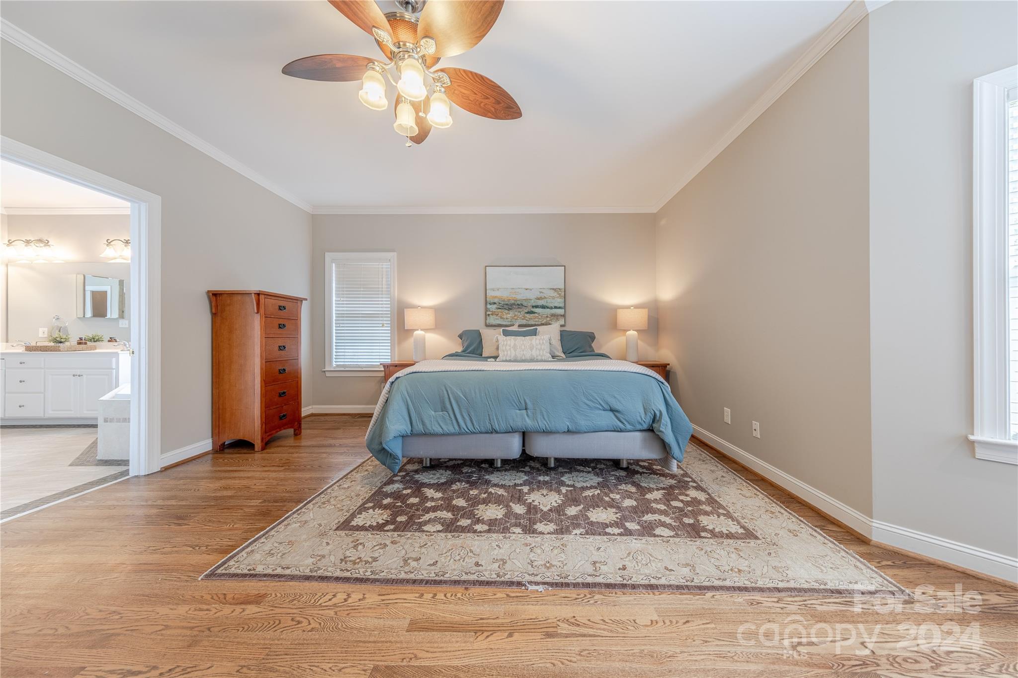 3321 Millstone Creek Road Lancaster, SC 29720 - Photo 23 of 48 a bedroom with a bed and a chandelier