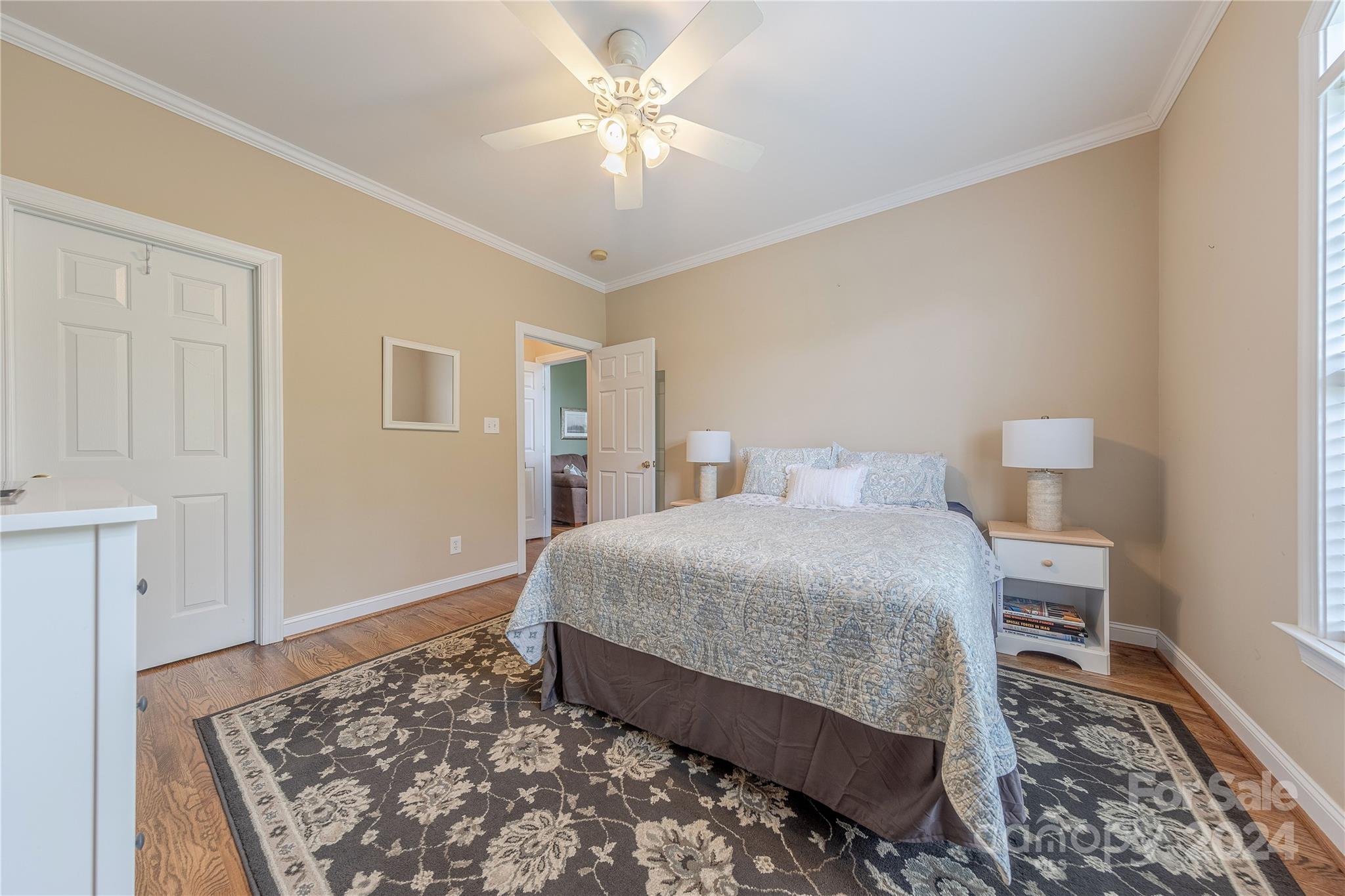 3321 Millstone Creek Road Lancaster, SC 29720 - Photo 31 of 48 a bedroom with a bed and a chandelier