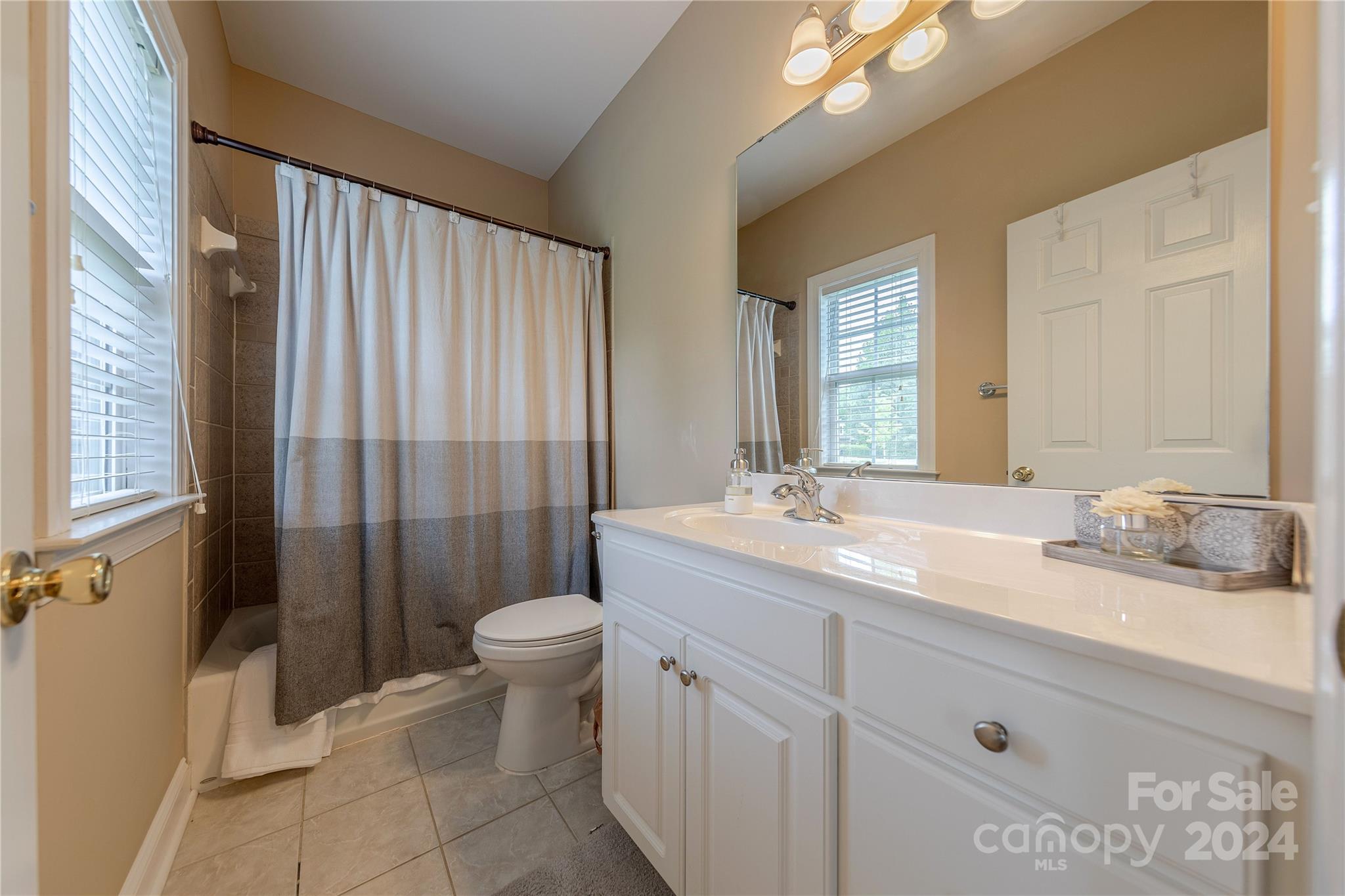 3321 Millstone Creek Road Lancaster, SC 29720 - Photo 32 of 48 a bathroom with a granite countertop sink toilet and shower