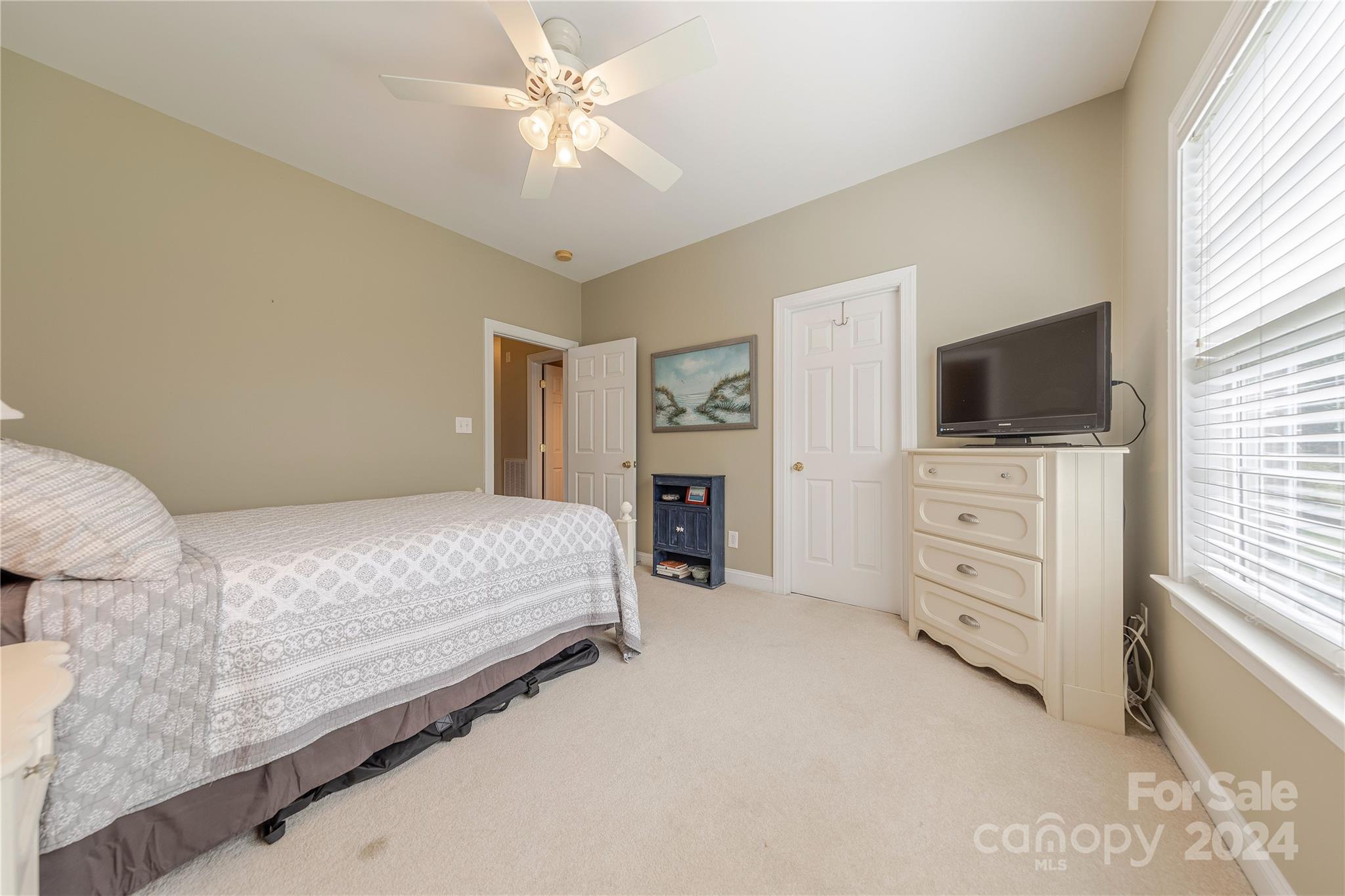 3321 Millstone Creek Road Lancaster, SC 29720 - Photo 34 of 48 a bedroom with a large bed and flat tv screen on dresser
