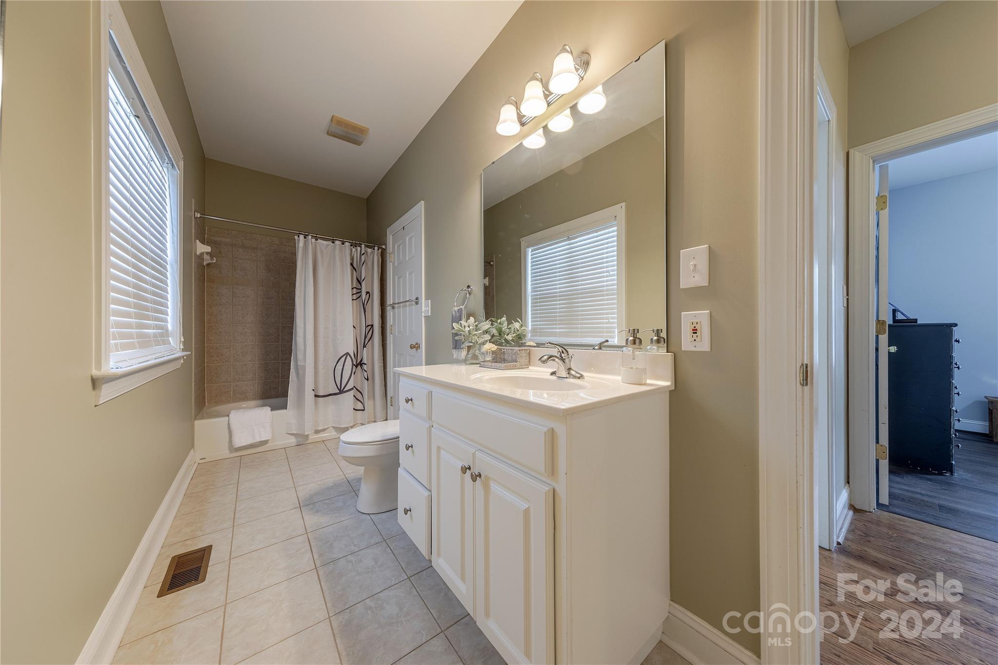 3321 Millstone Creek Road Lancaster, SC 29720 - Photo 37 of 48 a bathroom with a sink double vanity and a mirror