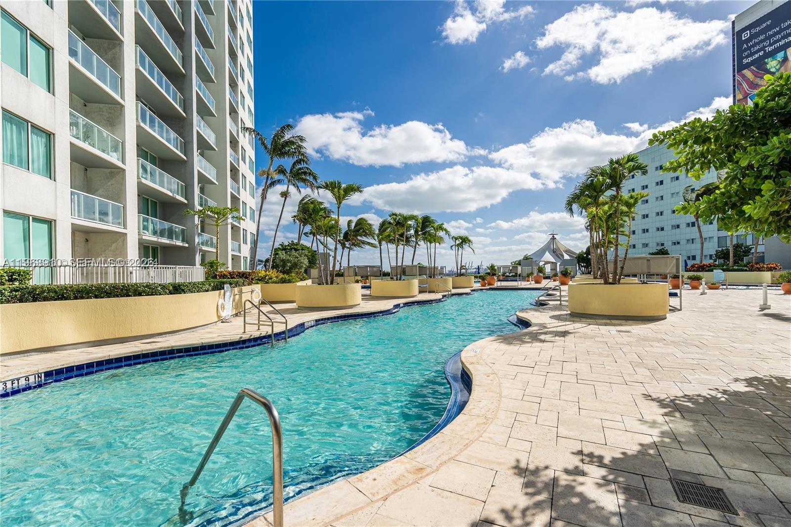 253 Northeast 2nd Street, Unit 433 Miami, FL 33132 - Photo 13 of 32 a view of a swimming pool with a patio