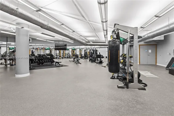 a bathroom with a shower and mirror