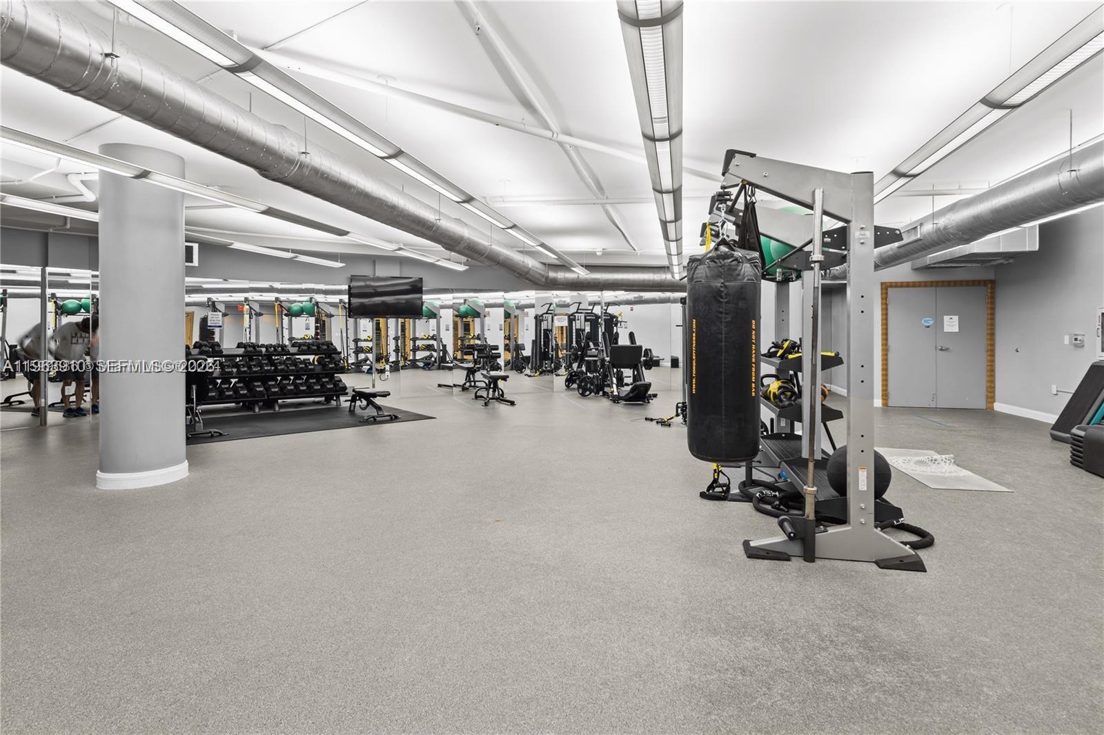 253 Northeast 2nd Street, Unit 433 Miami, FL 33132 - Photo 18 of 32 a view of a room with gym equipment