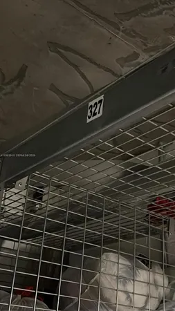 a front view of a multi story residential apartment building with a yard