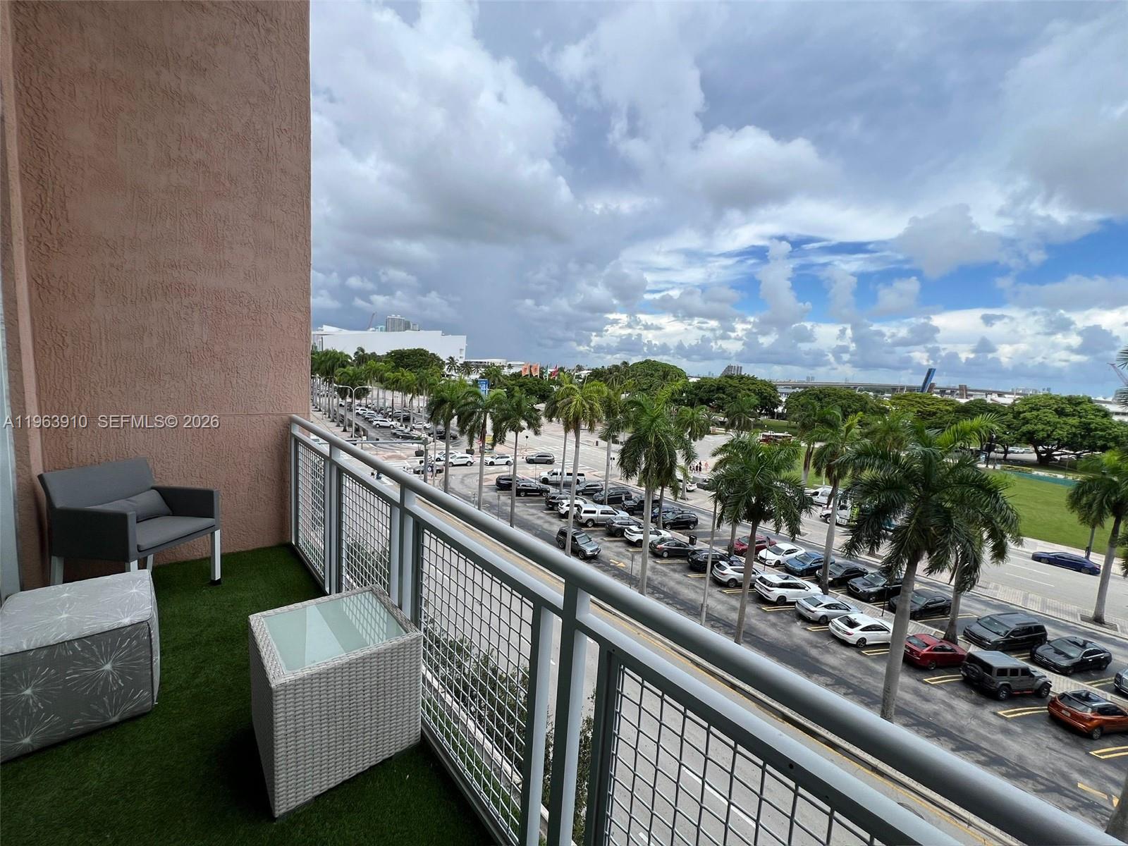 253 Northeast 2nd Street, Unit 433 Miami, FL 33132 - Photo 9 of 32 a view of balcony with furniture and city view