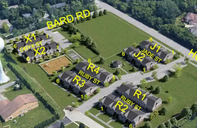 an aerial view of a golf course with street view