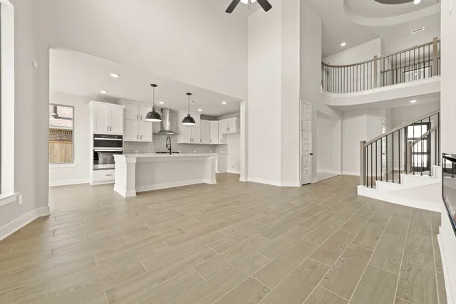 a view of a kitchen with a sink and cabinets