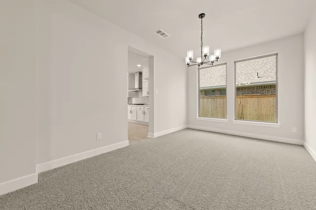 a view of a room with cabinet and windows