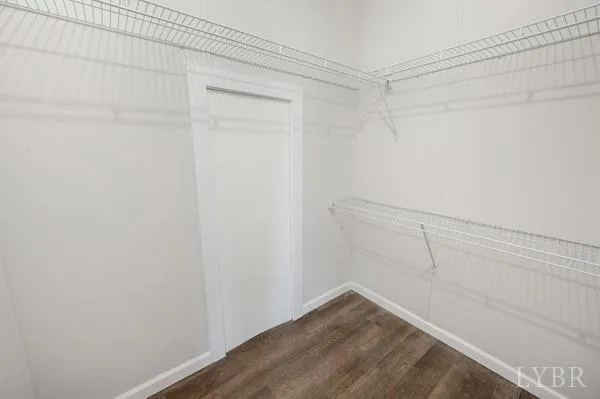 a view of backyard of house with green space