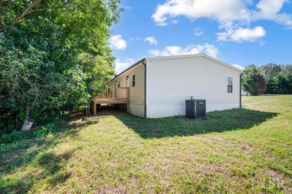a porch with wooden floor and outdoor space