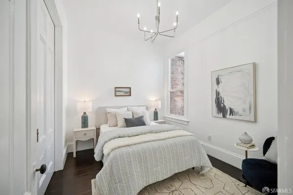 a bedroom with a bed and a dresser