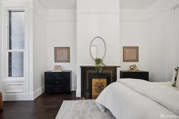 a view of a workspace with furniture and wooden floor