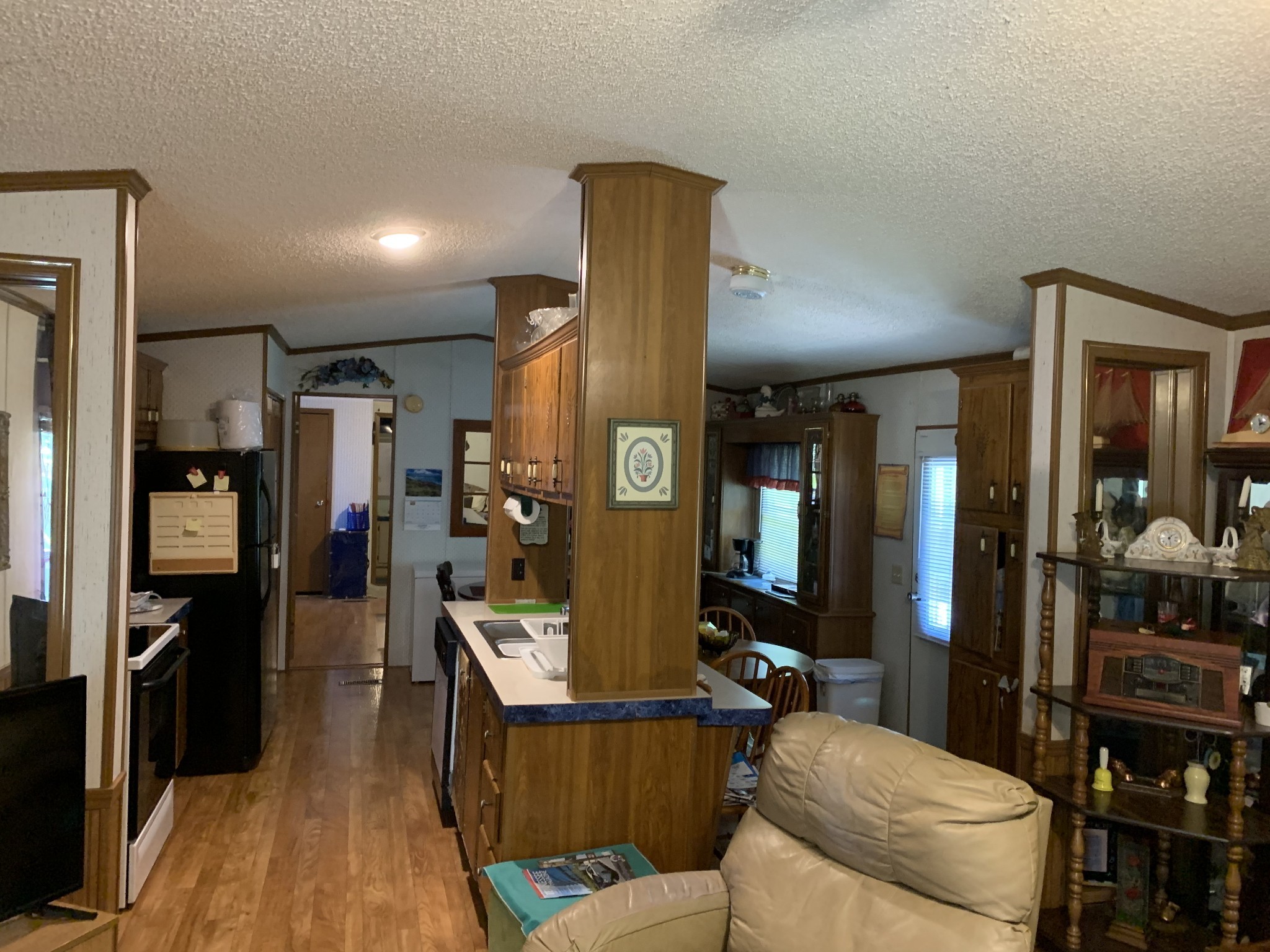 492 Panhandle Road Manchester, TN 37355 - Photo 13 of 19 a living room with stainless steel appliances furniture a rug and a view of kitchen