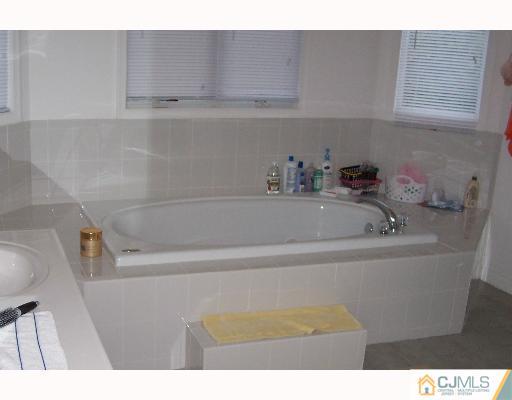 47 Westley Road Old Bridge, NJ 08857 - Photo 2 of 7 a bathroom with a bathtub