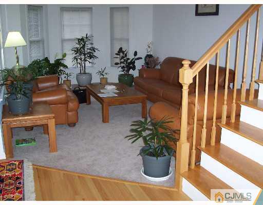 47 Westley Road Old Bridge, NJ 08857 - Photo 3 of 7 a living room with furniture potted plant and a table