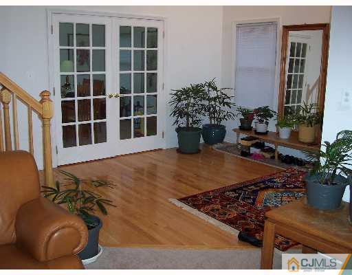 47 Westley Road Old Bridge, NJ 08857 - Photo 7 of 7 a front view of a house with potted plants