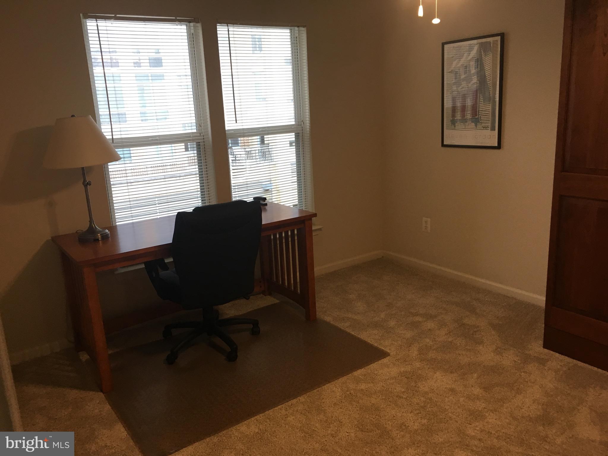 12000 Market Street, Unit 430 Reston, VA 20190 - Photo 11 of 24 a view of a workspace with furniture and a window
