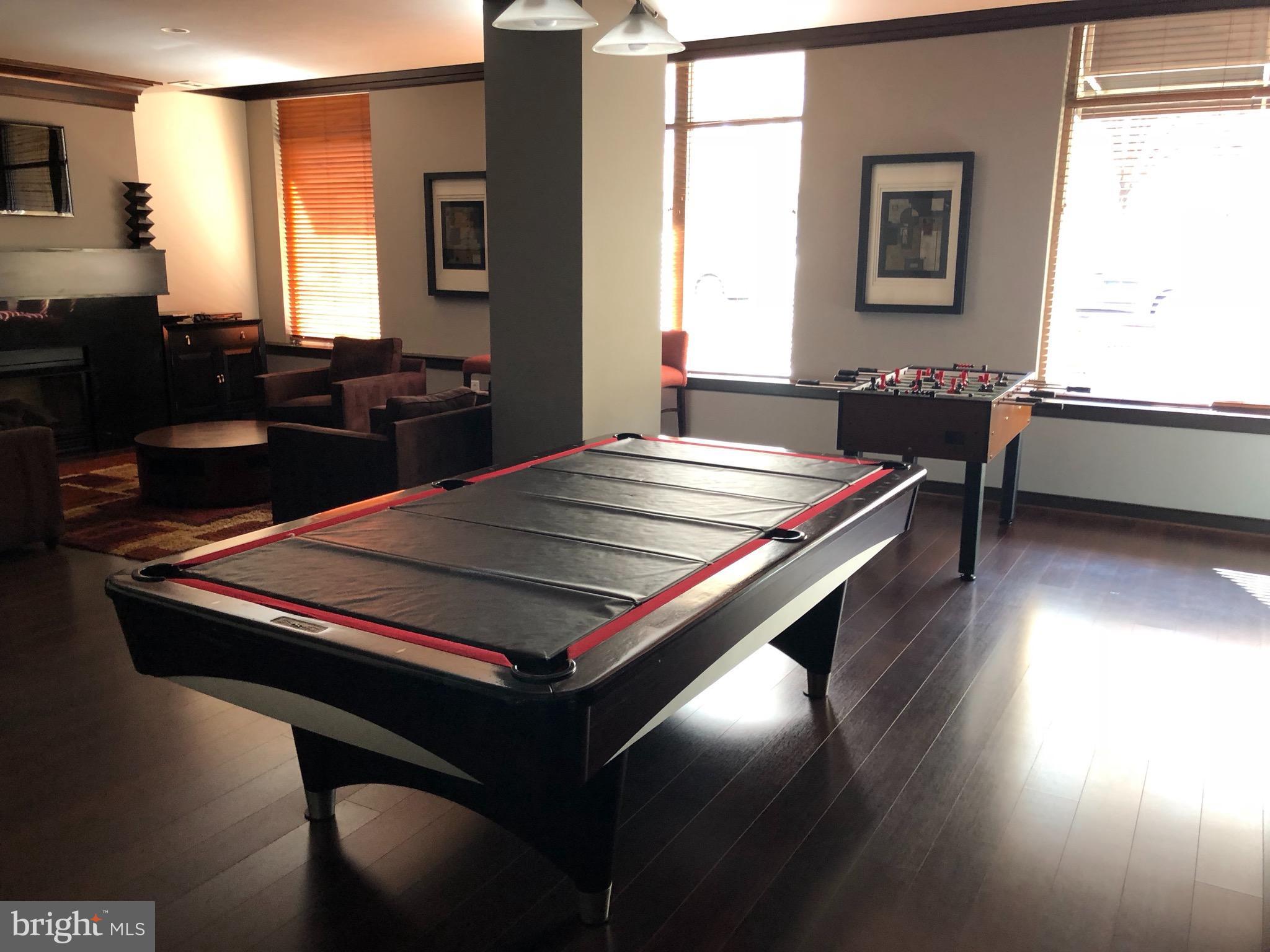 12000 Market Street, Unit 430 Reston, VA 20190 - Photo 16 of 24 a room with pool table and windows