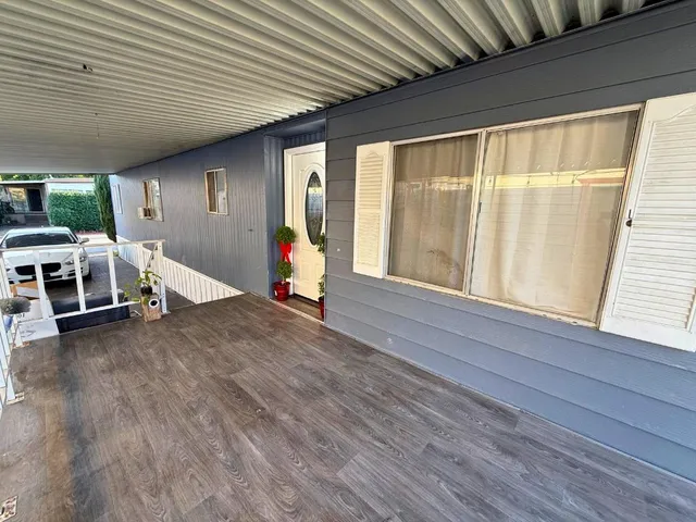 a view of livingroom with furniture and floor to ceiling window