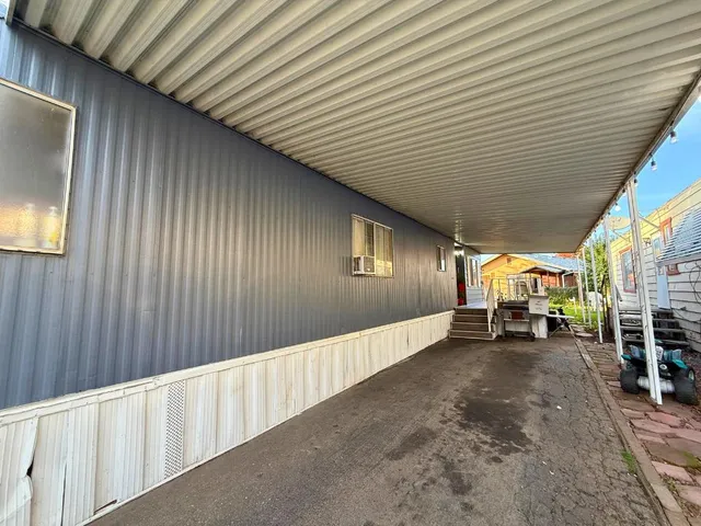 a view of an empty room with wooden walls