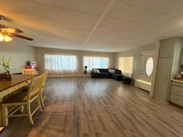 a view of a livingroom with furniture and a window