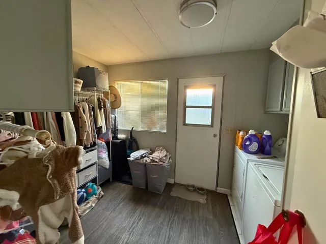 a bedroom with furniture and a closet