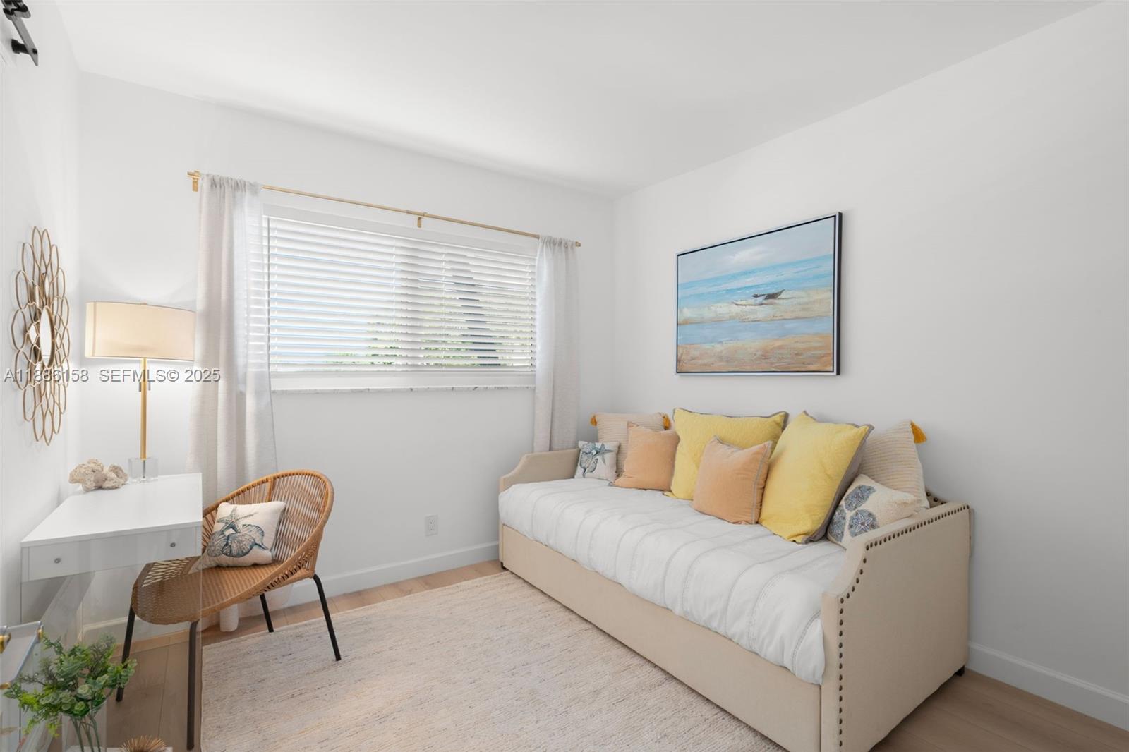 3301 Spanish Trail, Unit 207 Delray Beach, FL 33483 - Photo 11 of 38 a living room with a couch and a table