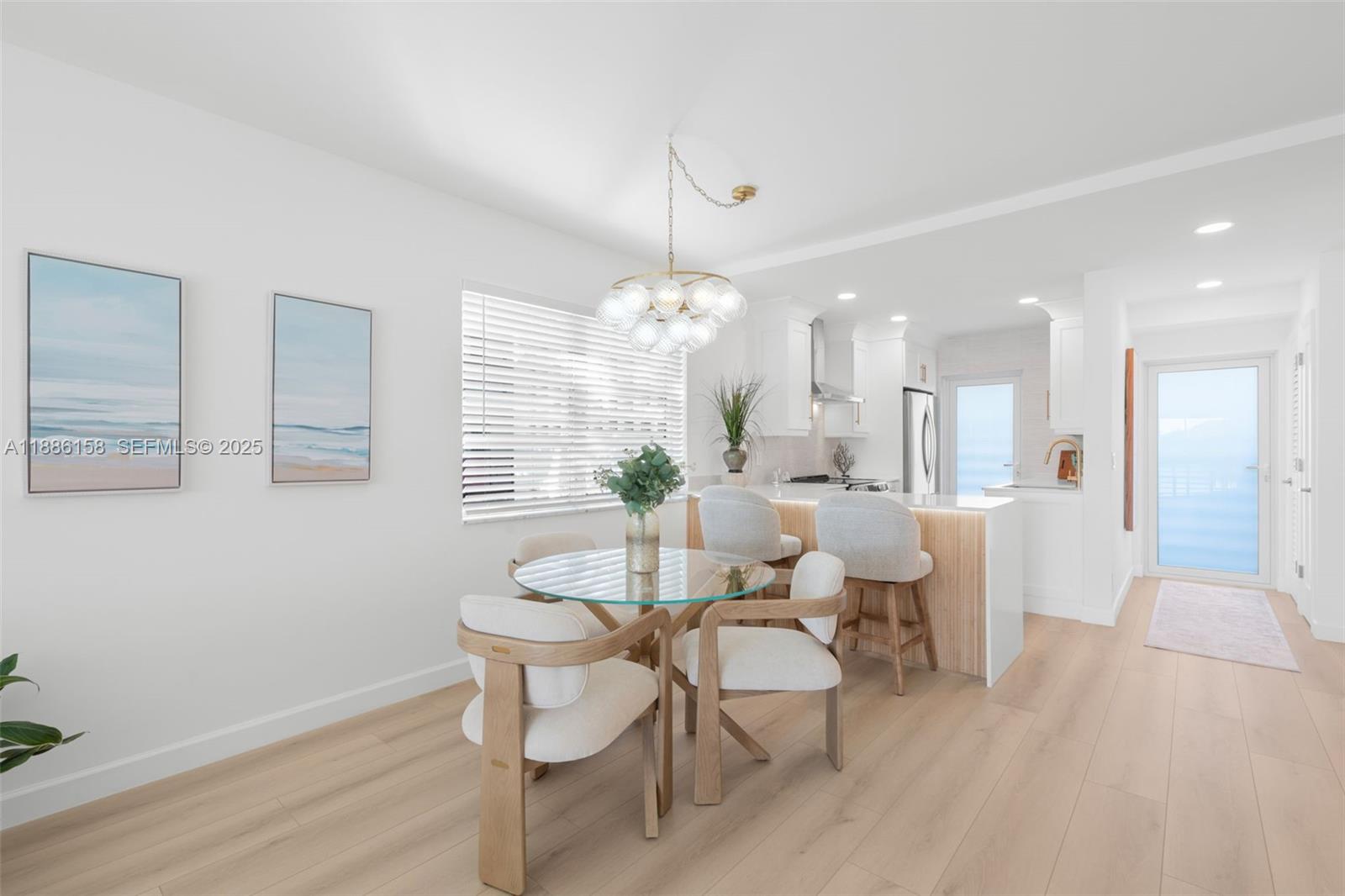 3301 Spanish Trail, Unit 207 Delray Beach, FL 33483 - Photo 13 of 38 a view of a dining room with furniture and wooden floor