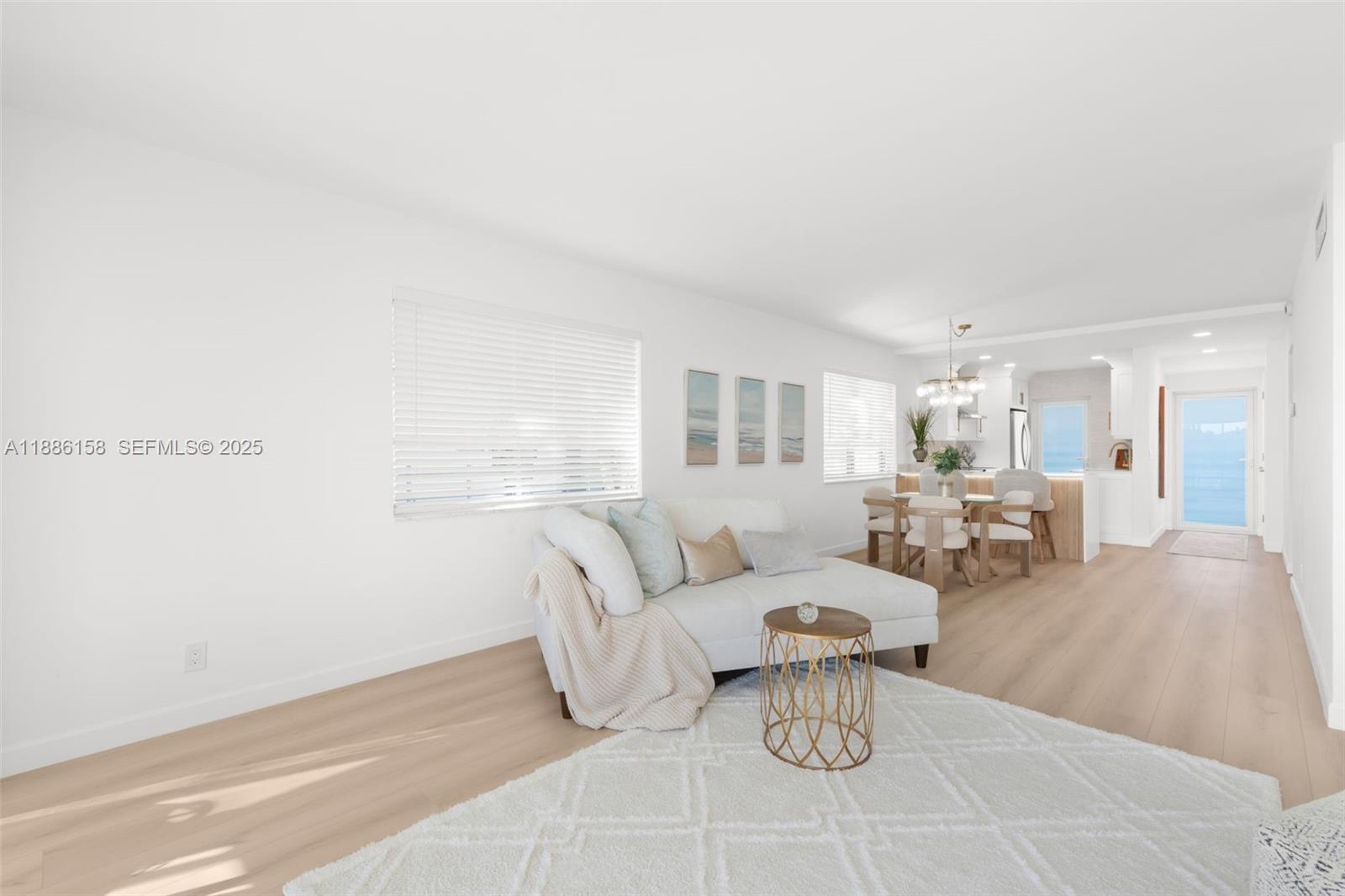 3301 Spanish Trail, Unit 207 Delray Beach, FL 33483 - Photo 14 of 38 a living room with furniture and a table