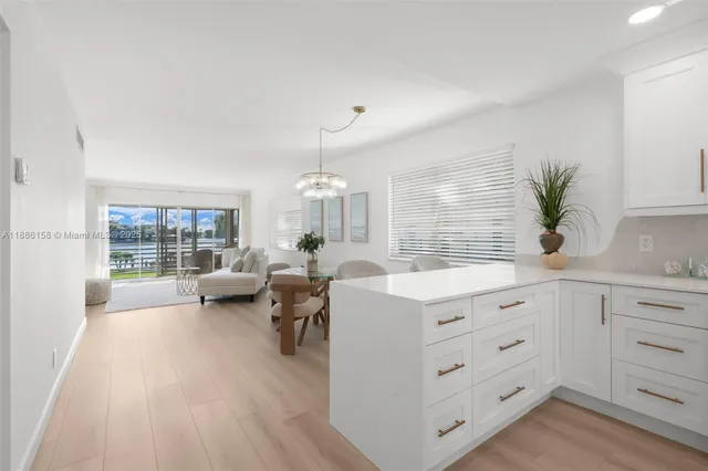 a spacious bathroom with double vanity and a large window