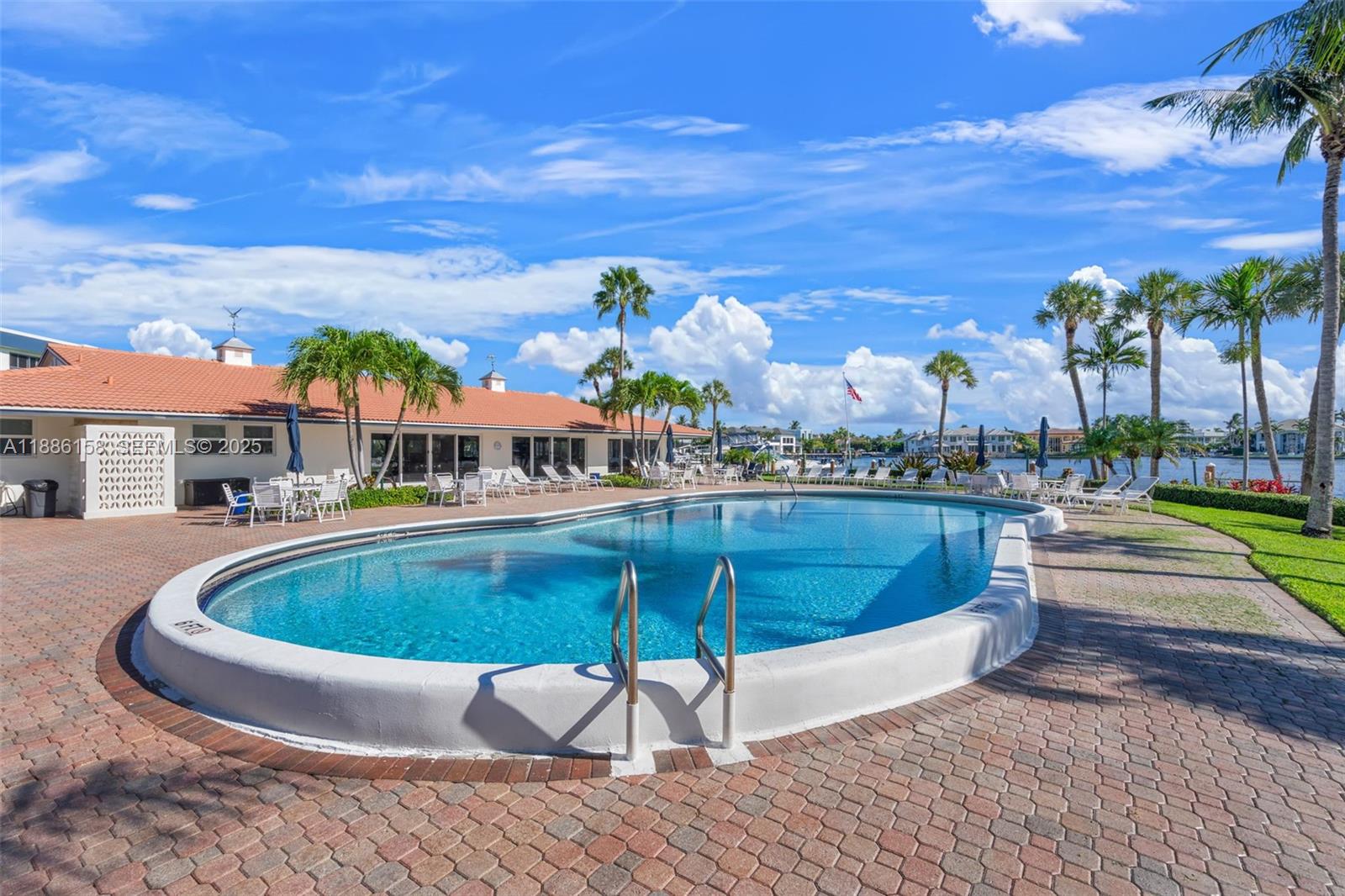 3301 Spanish Trail, Unit 207 Delray Beach, FL 33483 - Photo 26 of 38 a view of outdoor space yard swimming pool and outdoor seating