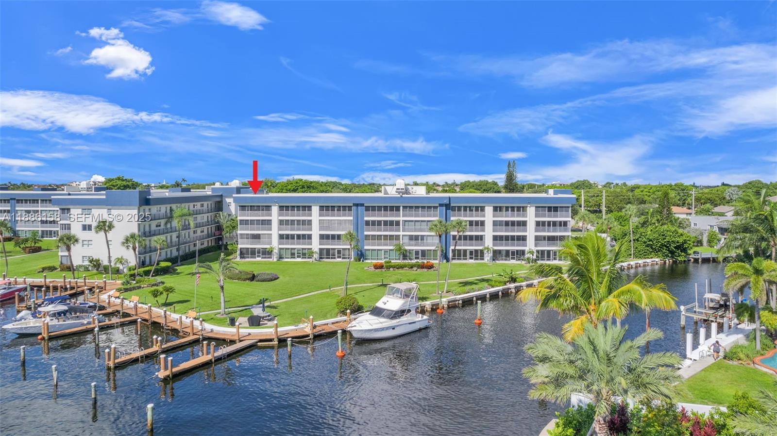3301 Spanish Trail, Unit 207 Delray Beach, FL 33483 - Photo 37 of 38 a view of a porch with furniture and a yard