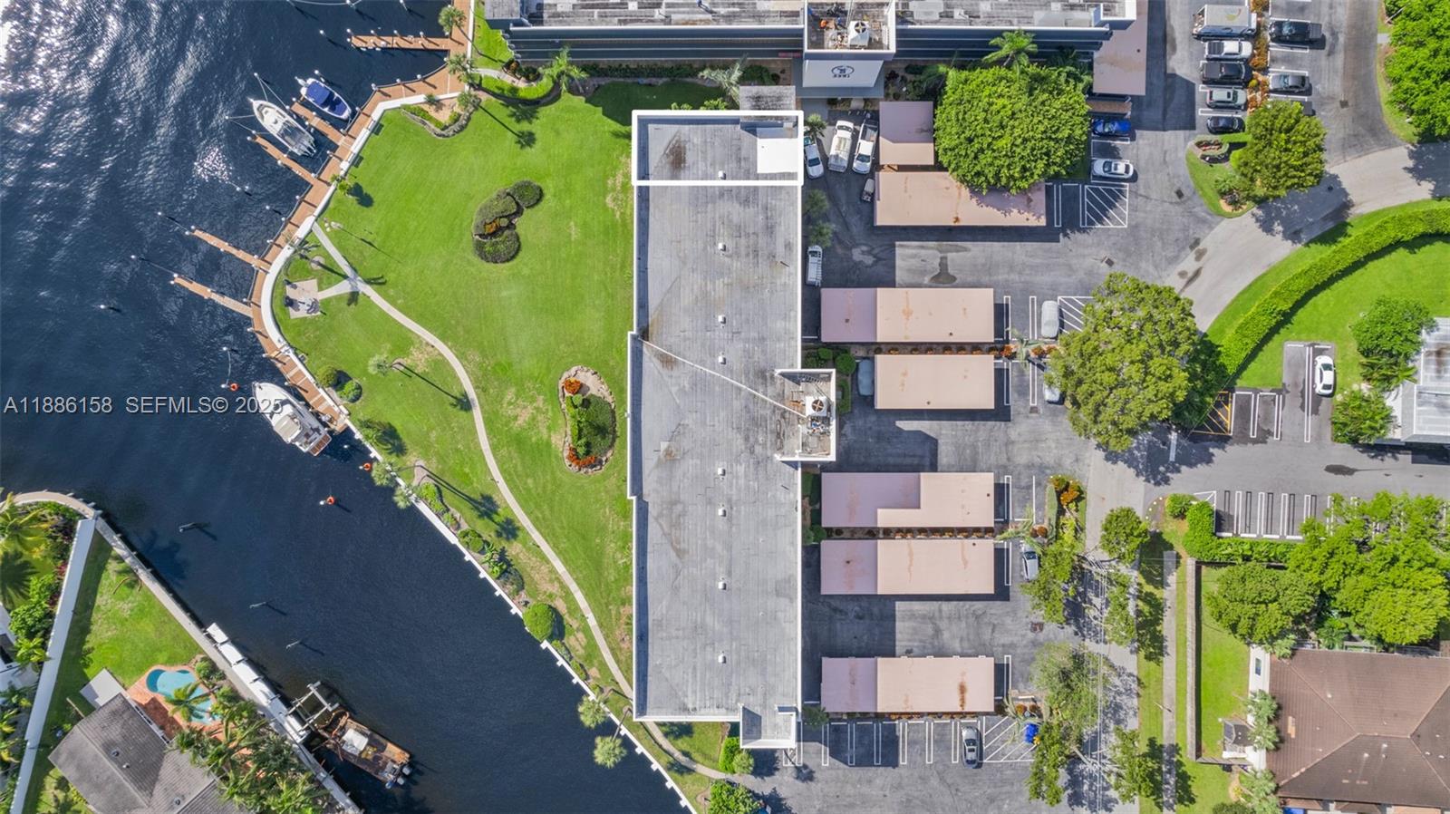 3301 Spanish Trail, Unit 207 Delray Beach, FL 33483 - Photo 38 of 38 an aerial view of a house with a swimming pool
