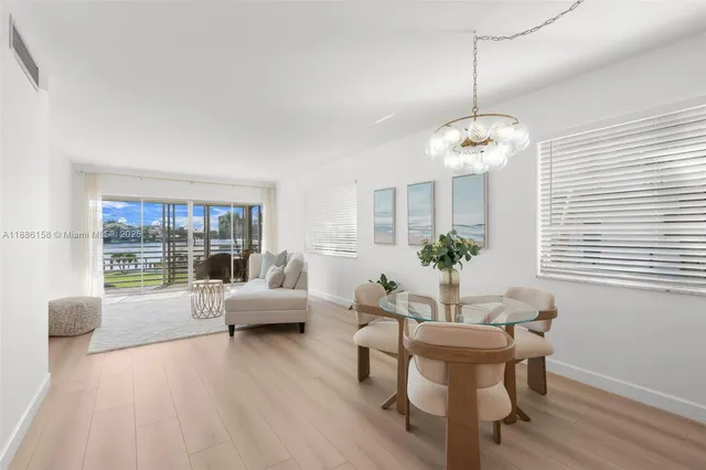 a view of a livingroom with furniture window and wooden floor
